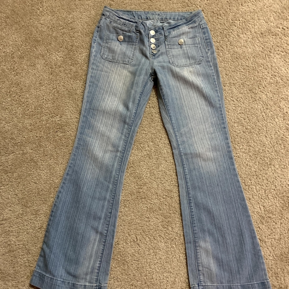 Light blue button fly flare jeans